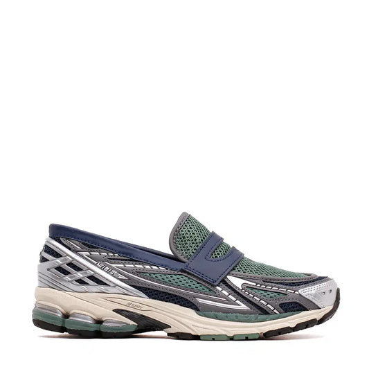 Athletic slip-on shoe with mesh upper and chunky sole in navy, green, and silver colors.