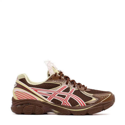 Brown and pink athletic running shoe with mesh panels and striped design.