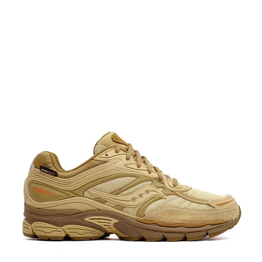 Tan/beige athletic running shoe with mesh and synthetic overlays.